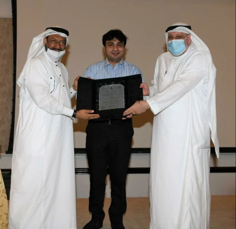 Professor Nadeem Shafique Butt receiving an award